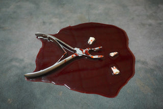 Blood Pool with Teeth and Tooth Extractor