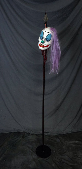 Clown Head Luttra on a Spike