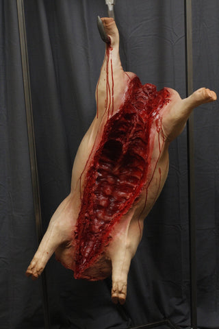 Headless Hanging Gutted Pig