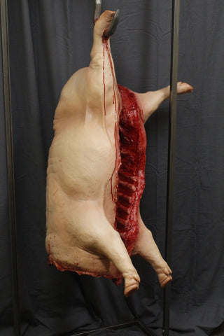 Headless Hanging Gutted Pig