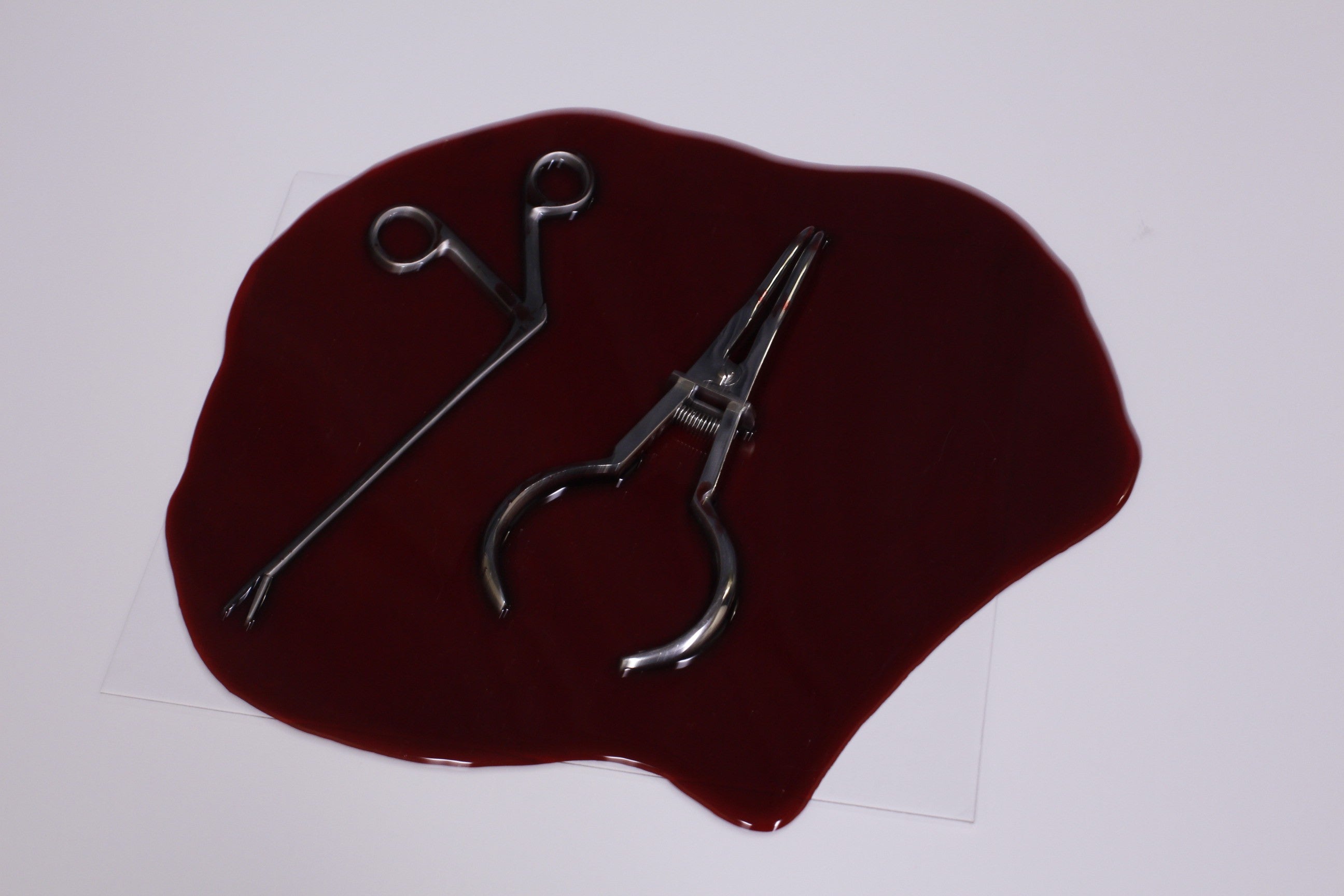 Resin Blood Pool with Medical Clamps – Dapper Cadaver Props