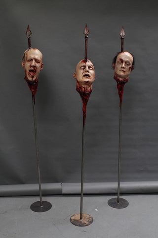 Three Assorted Heads on Spikes